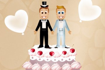 Two male wedding toppers on top of a cake